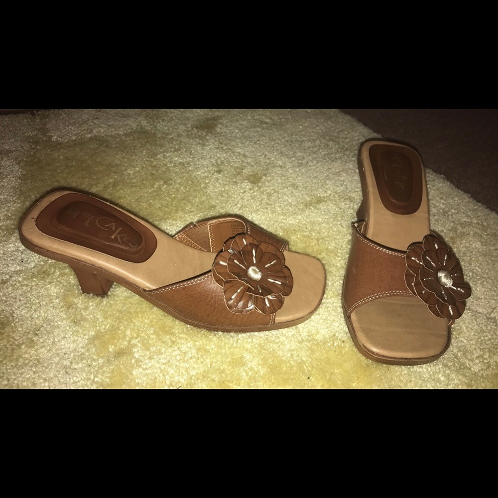 Brown, low heeled sandals.